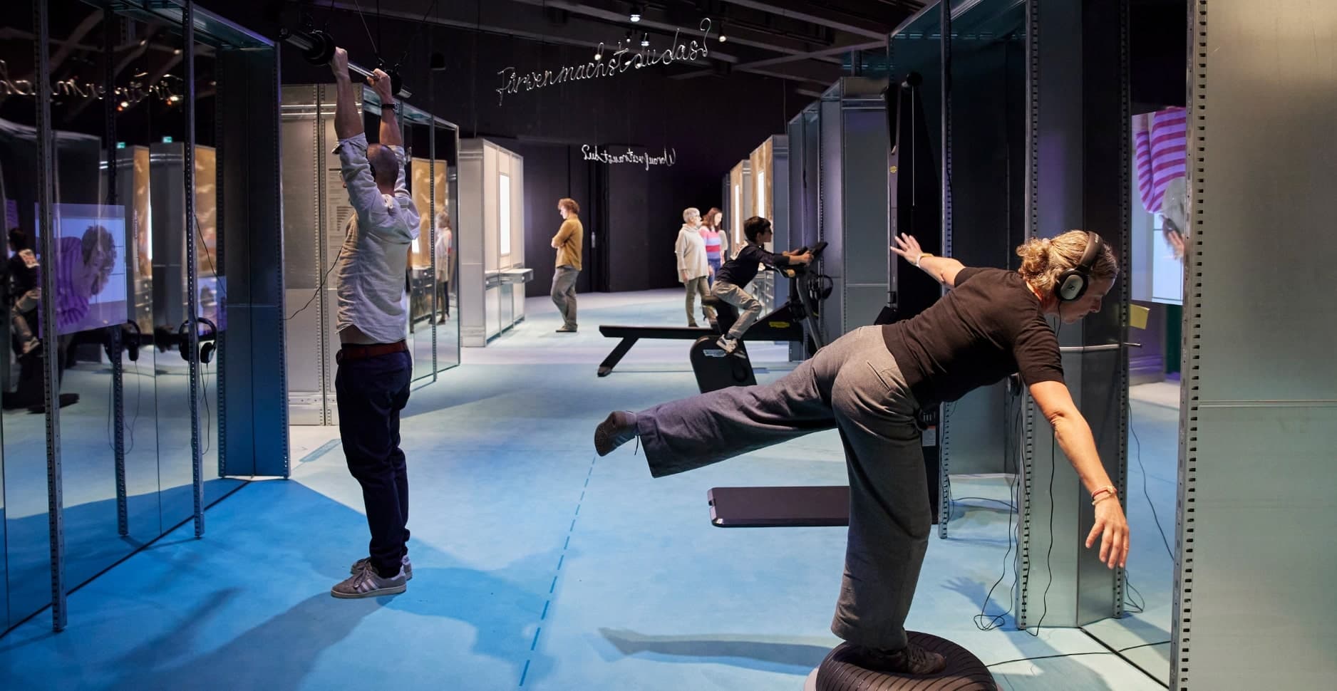 Exhibition area featuring functioning fitness machines.