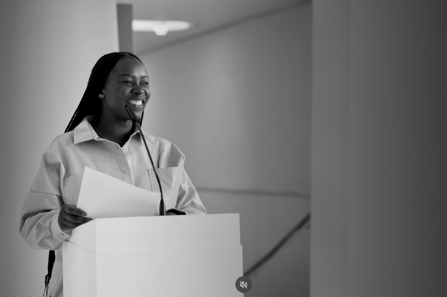 Black and White image of Mary giving a talk at a university