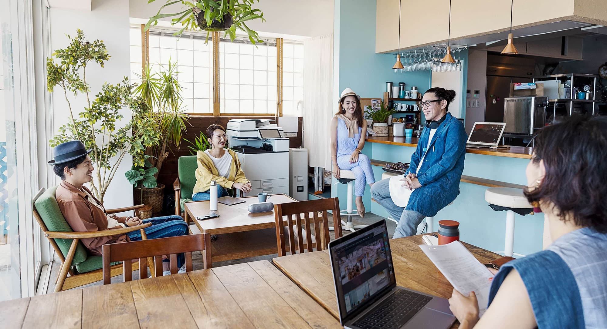 A group of young professionals working in a coworking space